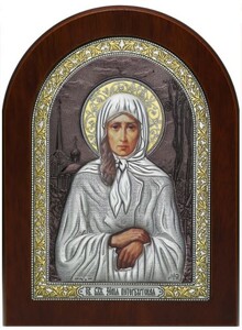 Icon "Saint Xenia of St. Petersburg" colored brown lacquer