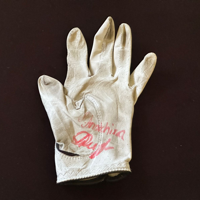 An autographed glove by golfer Sofia Anokhina