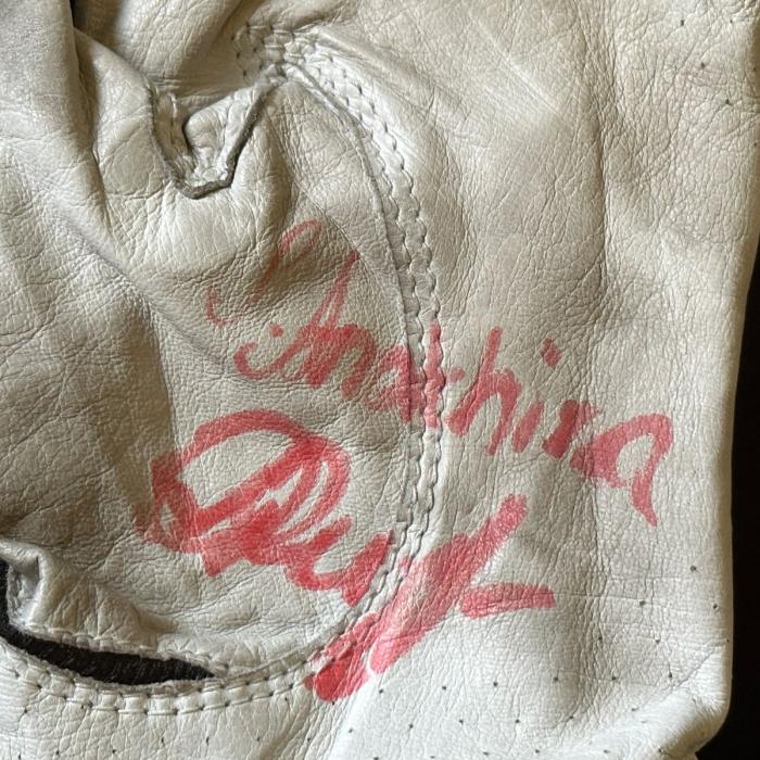 An autographed glove by golfer Sofia Anokhina