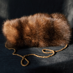 Sable fur clutch, gold pendant