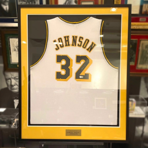 An autographed jersey of basketball player Magic Johnson