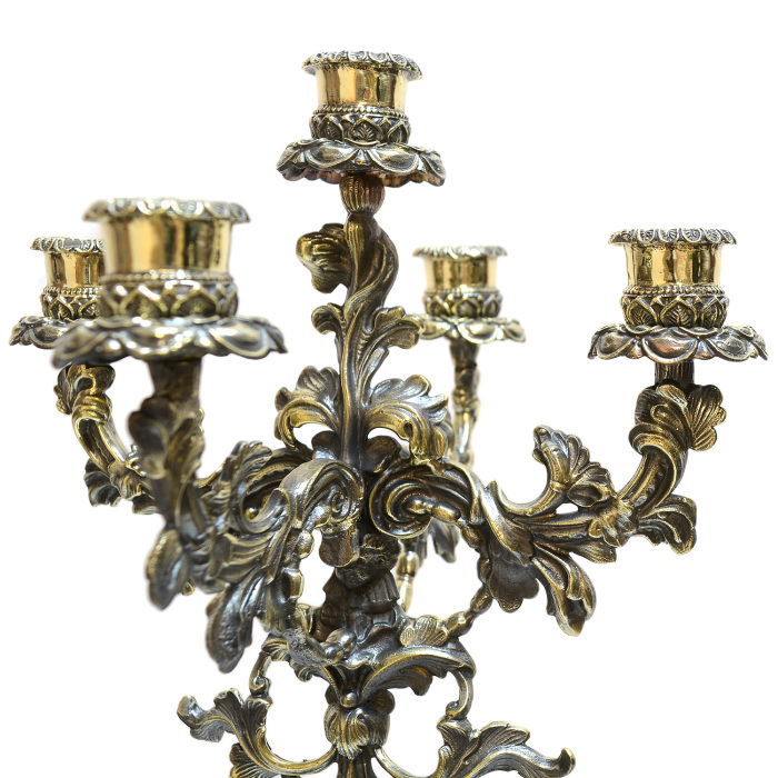 A pair of bronze candelabra "Diana" on a crenoid