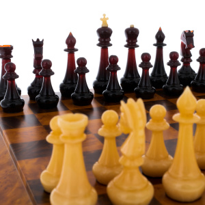 Cap chess with amber pieces