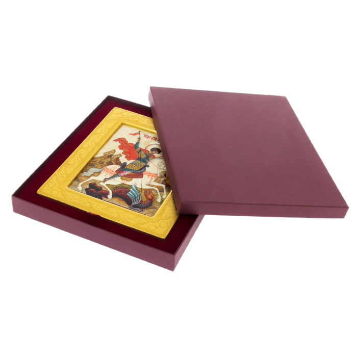 The icon of St. George the Victorious on natural mother-of-pearl in a gold frame