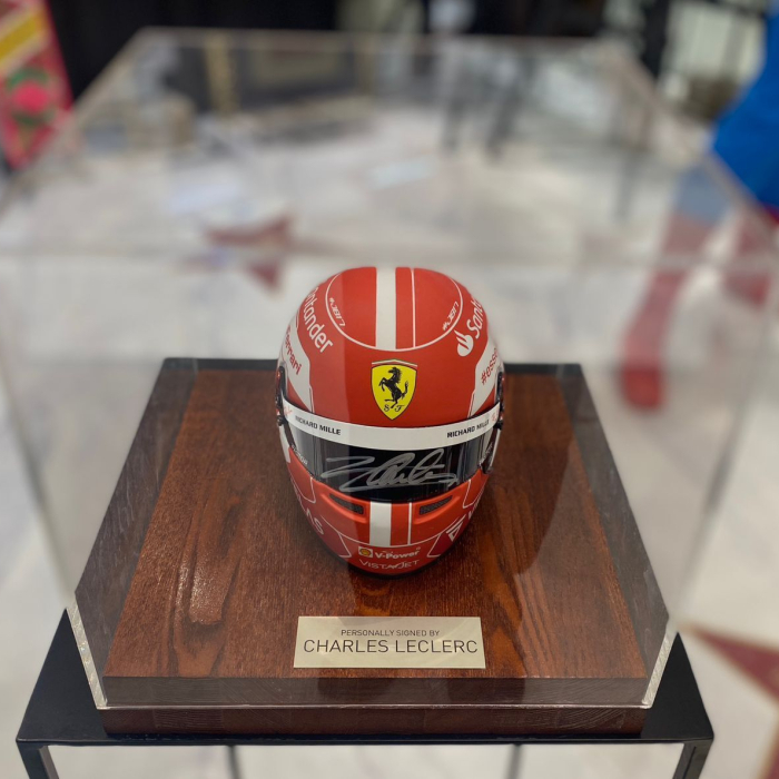 A mini helmet autographed by racing driver Charles Leclair