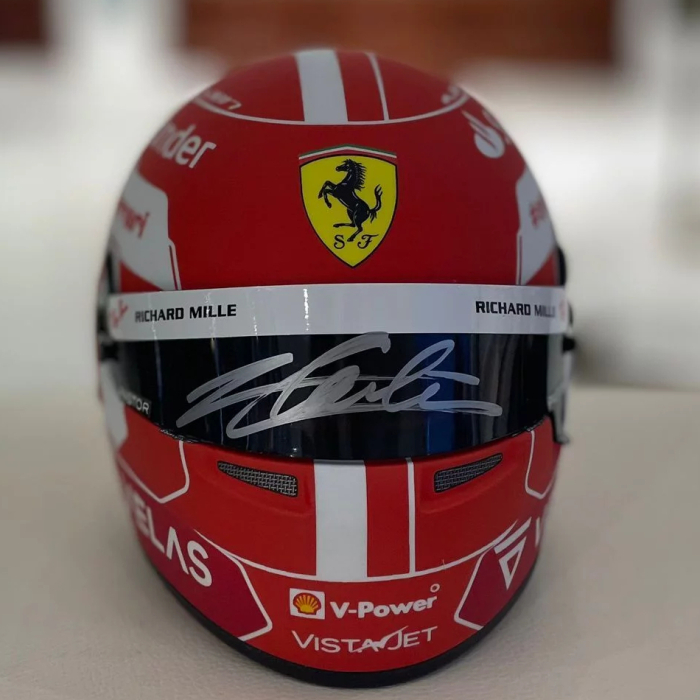 A mini helmet autographed by racing driver Charles Leclair