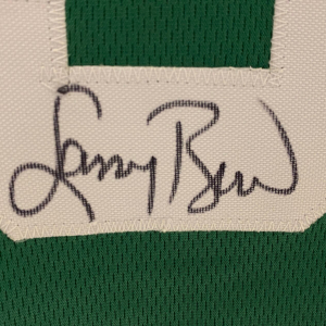 An autographed T-shirt by basketball player Larry Bird